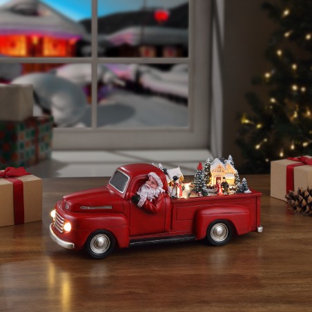 Roter nostalgischer Pick-Up mit Santa