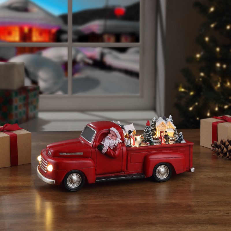 Roter nostalgischer Pick-Up mit Santa
